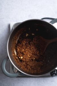 Chocolate protein powder oats in a pot.