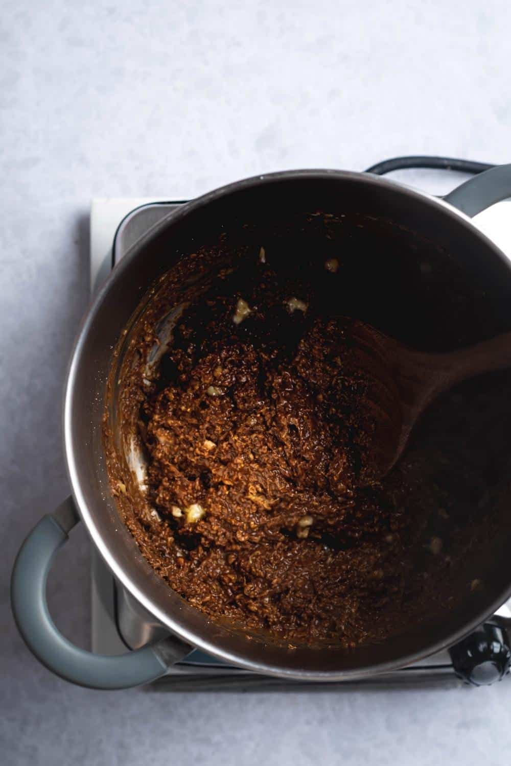 Chocolate protein powder oats in a pot.