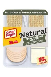 A box of Oscar Mayer natural slow roasted turkey with white cheddar cheese and whole wheat crackers.