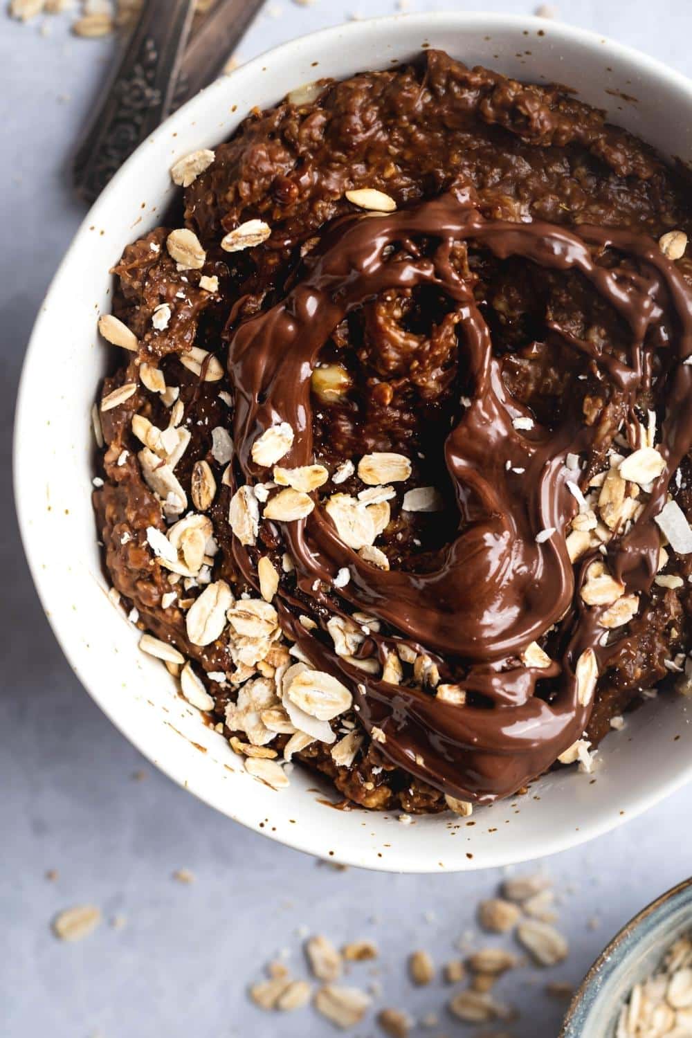 Protein oatmeal in part of a white bowl.