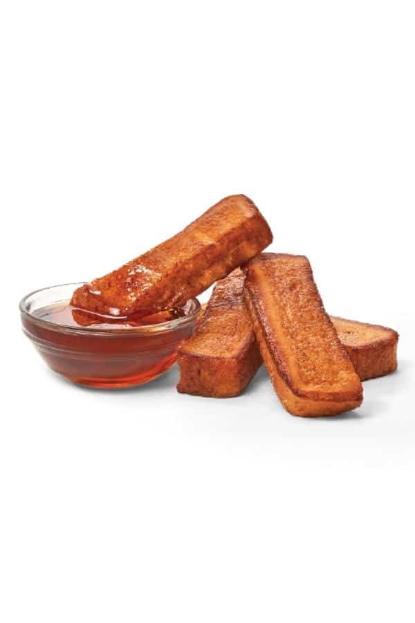 Four french toast sticks and maple syrup.