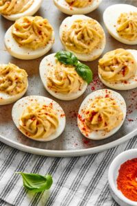 Half of a plate with a bunch of southern deviled eggs.