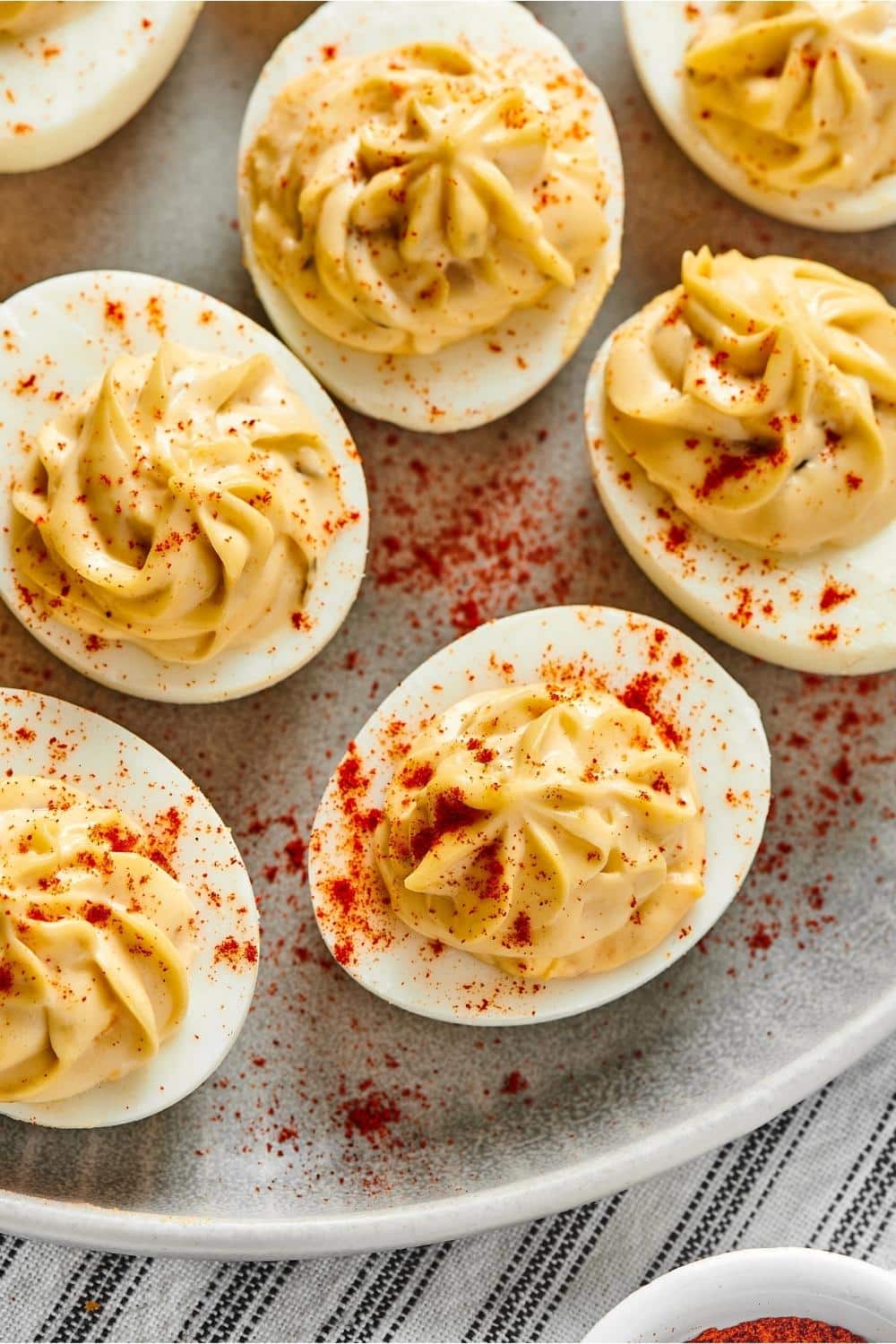 Five southern deviled eggs on a plate.