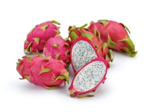 A dragonfruit cut in half surrounded by four other dragonfruits.