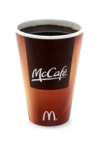 A mccafe cup of black coffee.