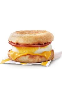 An english muffin with a slice of Candian bacon, an egg, and American cheese.