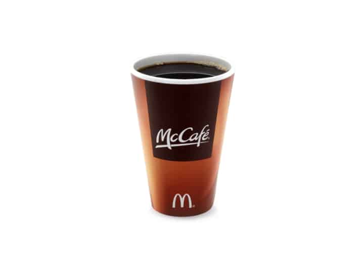 A mccafe cup of black coffee.