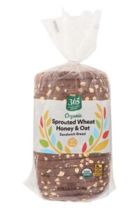 A pack of 365 Organic sprouted wheat honey and oat sandwich bread.