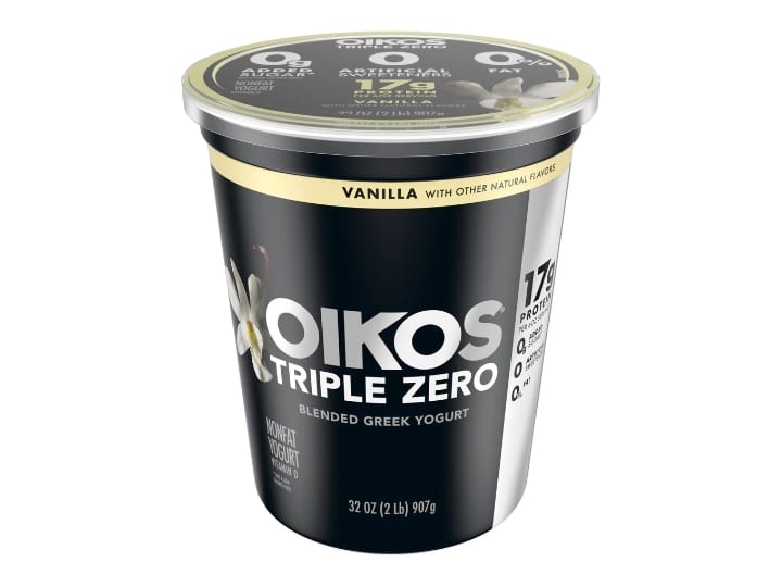 A tub of Oikos triple zero vanilla blended Greek yogurt.