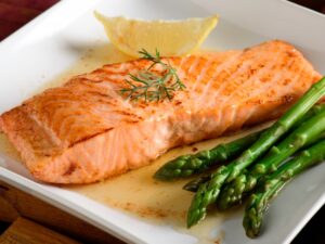 A piece of salmon on a dish.