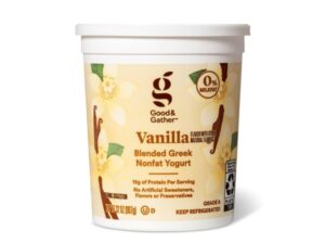 A tub of good and gather vanilla blended Greek nonfat yogurt.