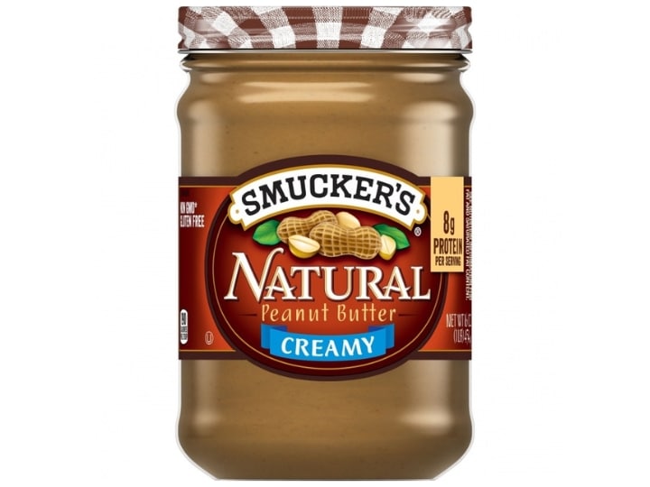 A bottle of Smucker's natural peannt butter.