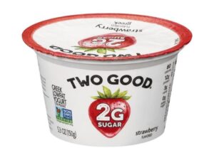 A container of two good strawberry flavored yogurt.