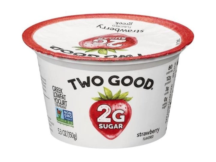 A container of two good strawberry flavored yogurt.