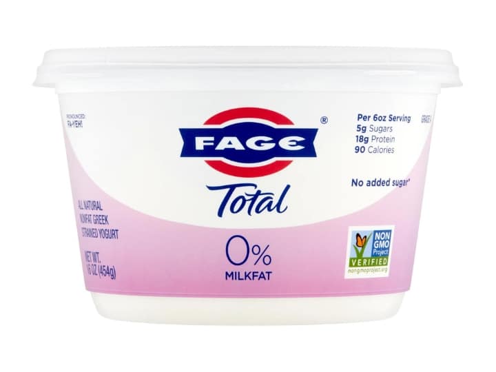 A container of Fage total 0% yogurt.