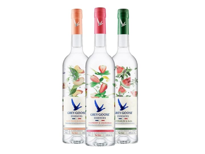 Three bottles of Grey Goose Essences vodka.