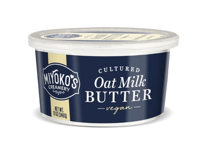 A tub of Miyokos cultured oat milk vegan butter.