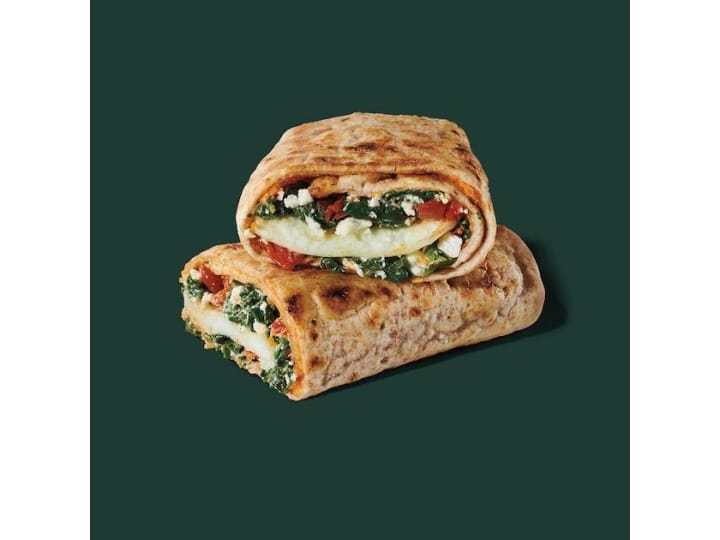 A wrap with spinach, egg white, feta, and tomato.