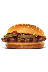 A burger king hamburger with pickles, mustard, and kethcup.