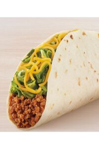 A taco bell soft taco with ground beef, lettuce, and cheese.