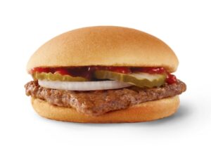 A Wendy's jr hamburger with ketchup, pickles, and onions.
