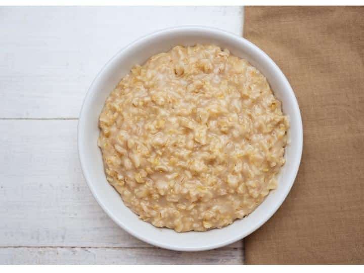 A white bowl filled with oatmeal.