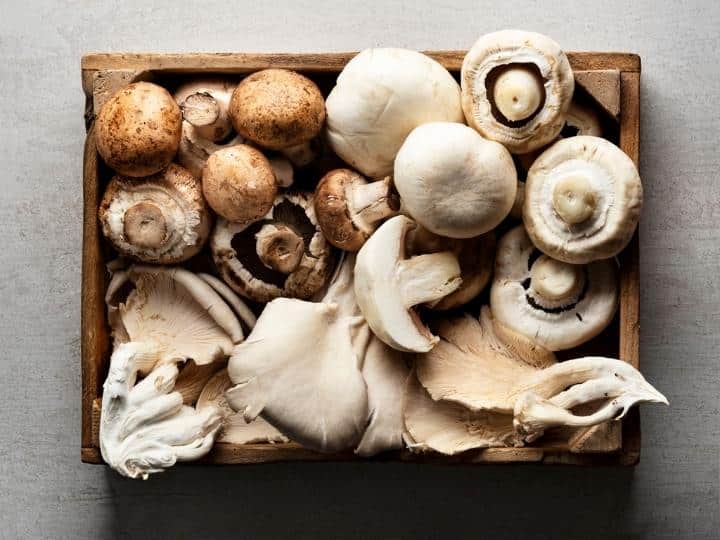 A bunch of mushrooms in a crate.