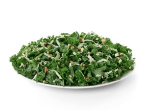 A chick fil a kale crunch salad with almonds.