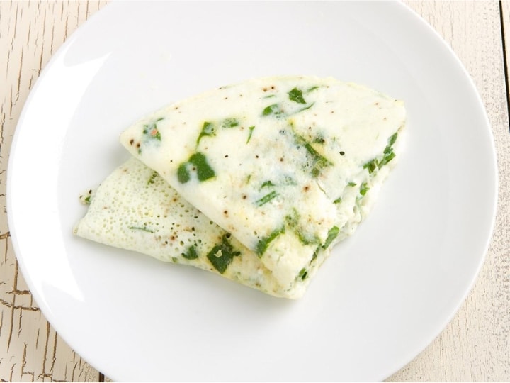 Two triangle egg white omelettes on top of one another.