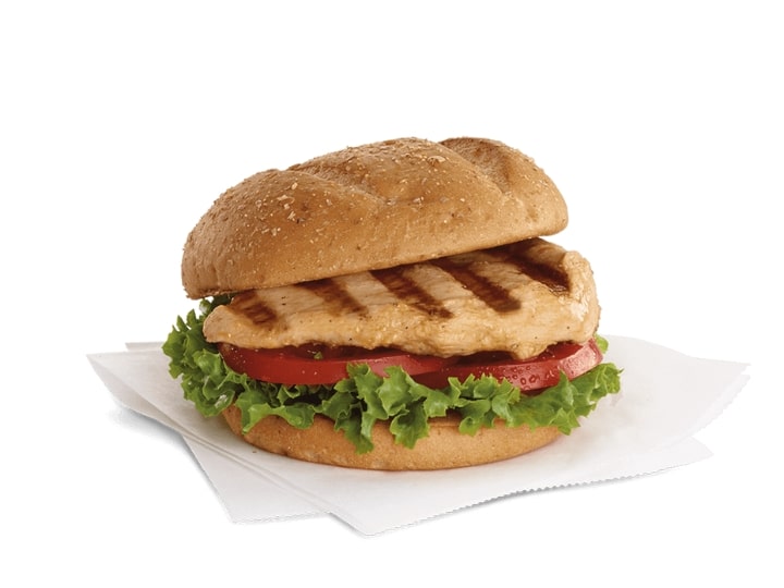 A chick fil a grilled chicken sandwich with lettuce and tomato.