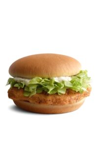 A mcdonalds mcchicken sandwich with lettuce and mayo.