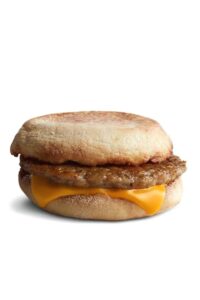 An english muffin with sausage and cheese.