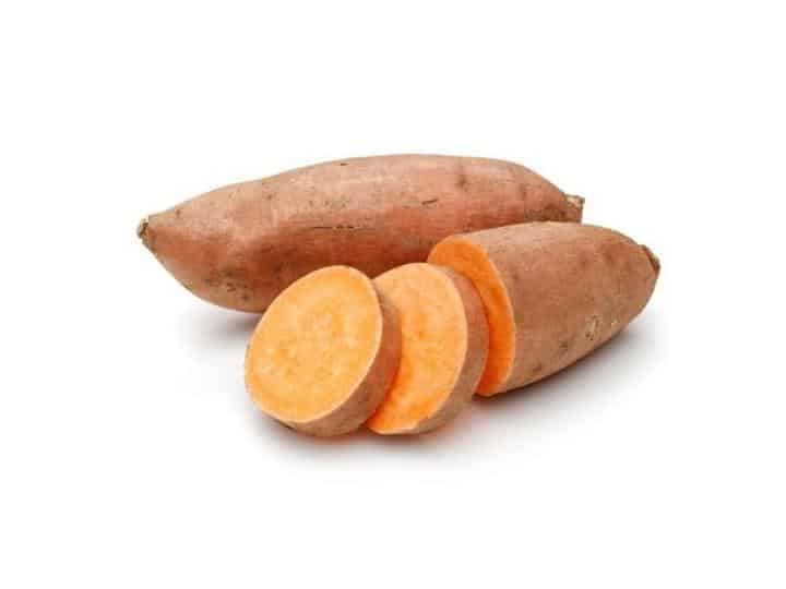 A cut sweet potato and whole sweet potato.