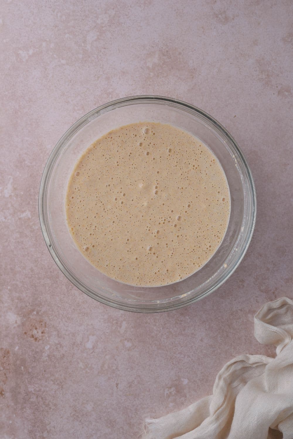 A glass bowl of oat flour pancake batter.