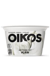 A container of Oikos anything but plain blended Greek yogurt.