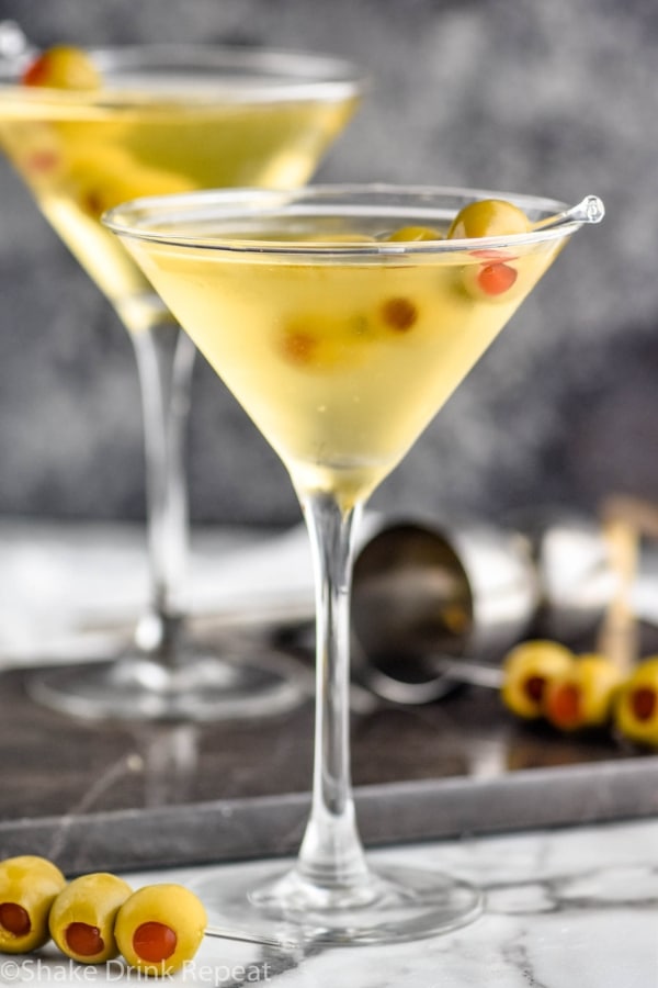 A martini glass filled with a dirty martini.