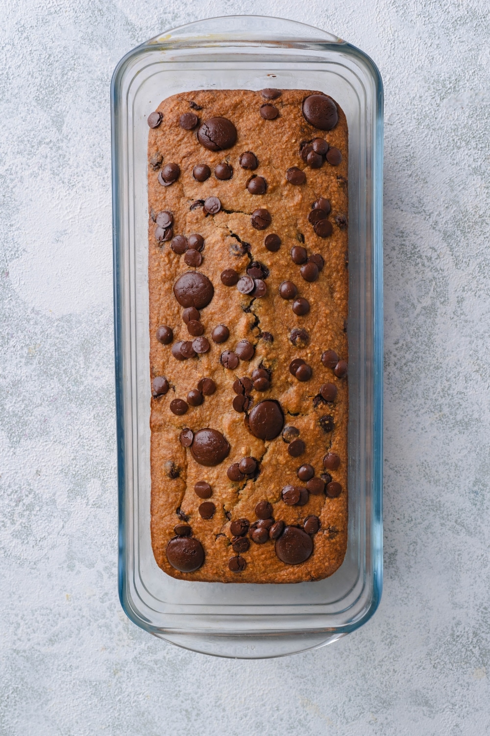 Oatmeal chocolate chip banana bread in a loaf pan.
