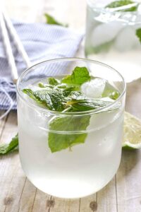 A glass filled with a skinny mojito.