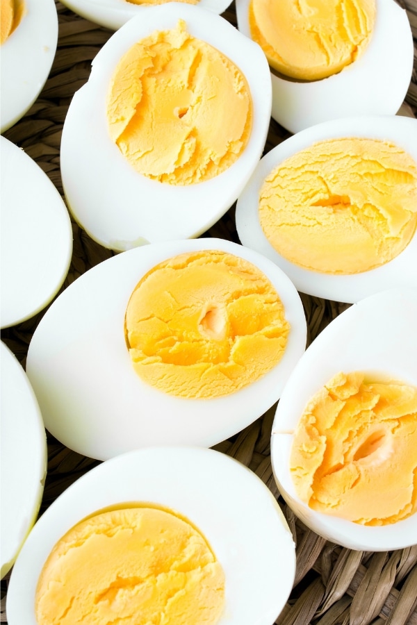 A bunch of halved hard boiled eggs.