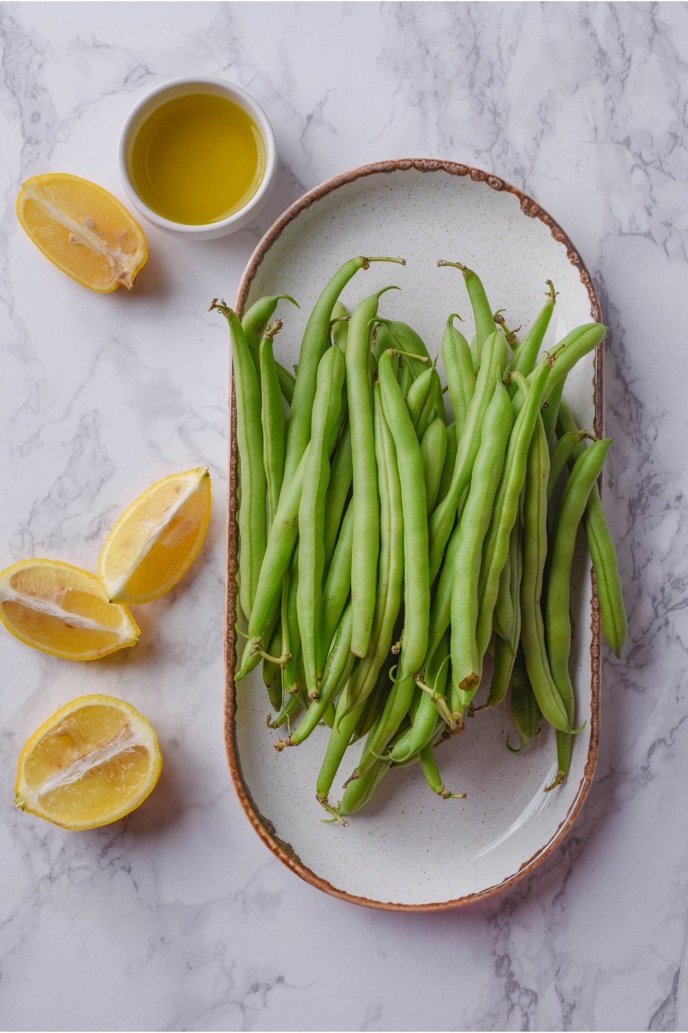 A bunch of green beans on a plate.