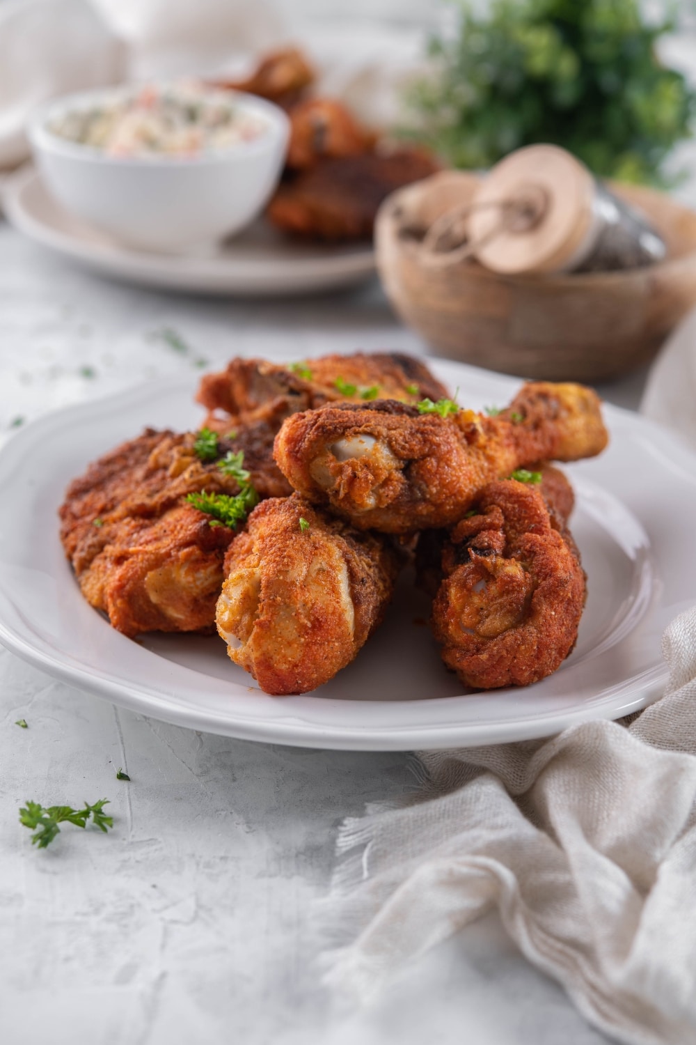 A plate of baked chicken legs and thighs.