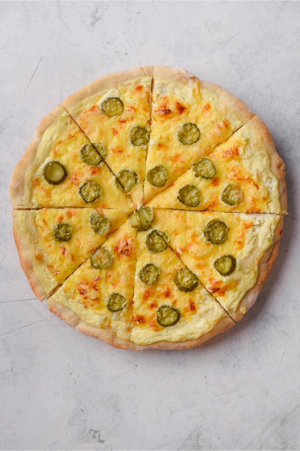 Top view of a whole dill pickle pizza.