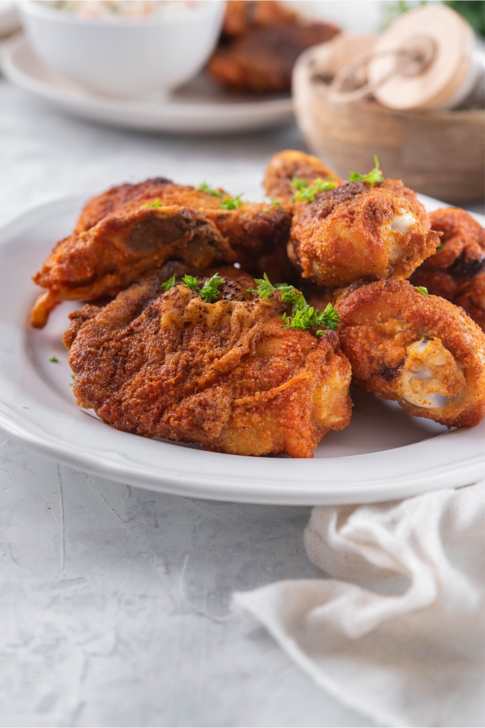 Baked chicken legs and thighs on a plate.