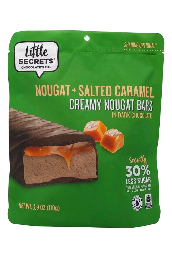 A bag of Little Secrets nougat and salted caramel creamy nougat bars in dark chocolate.