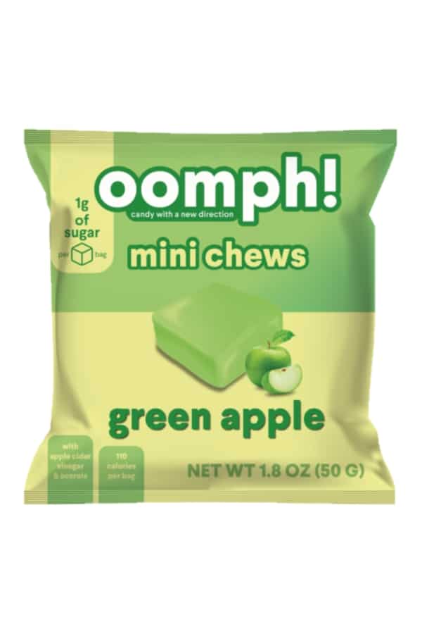 A bag of omph mini chews green apple flavor.