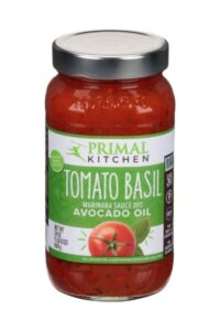 A bottle of Primal Kitchen Tomato Basil Marinara Sauce with Avocado Oil.