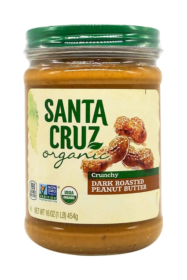 A jar of Santa Cruz Organic Crunchy Dark Roasted Peanut Butter.