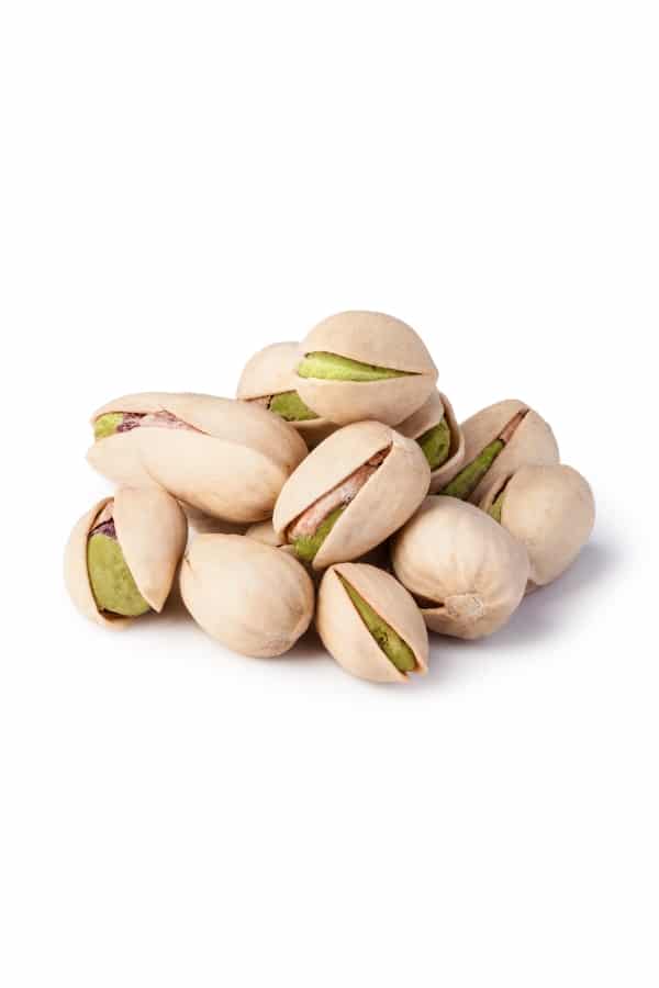 A bunch of pistachios in a bunch.
