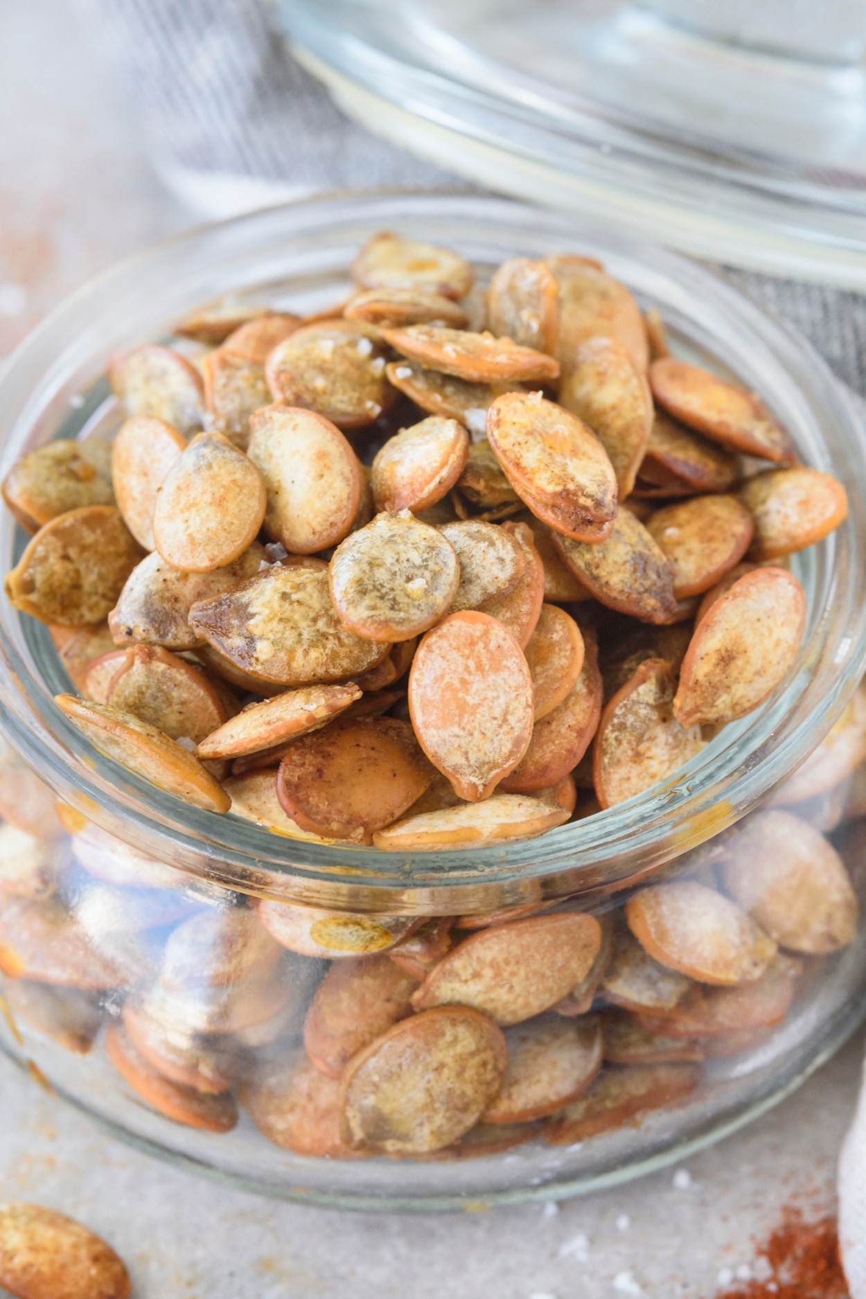 Pumpkin seeds in a glass jar.