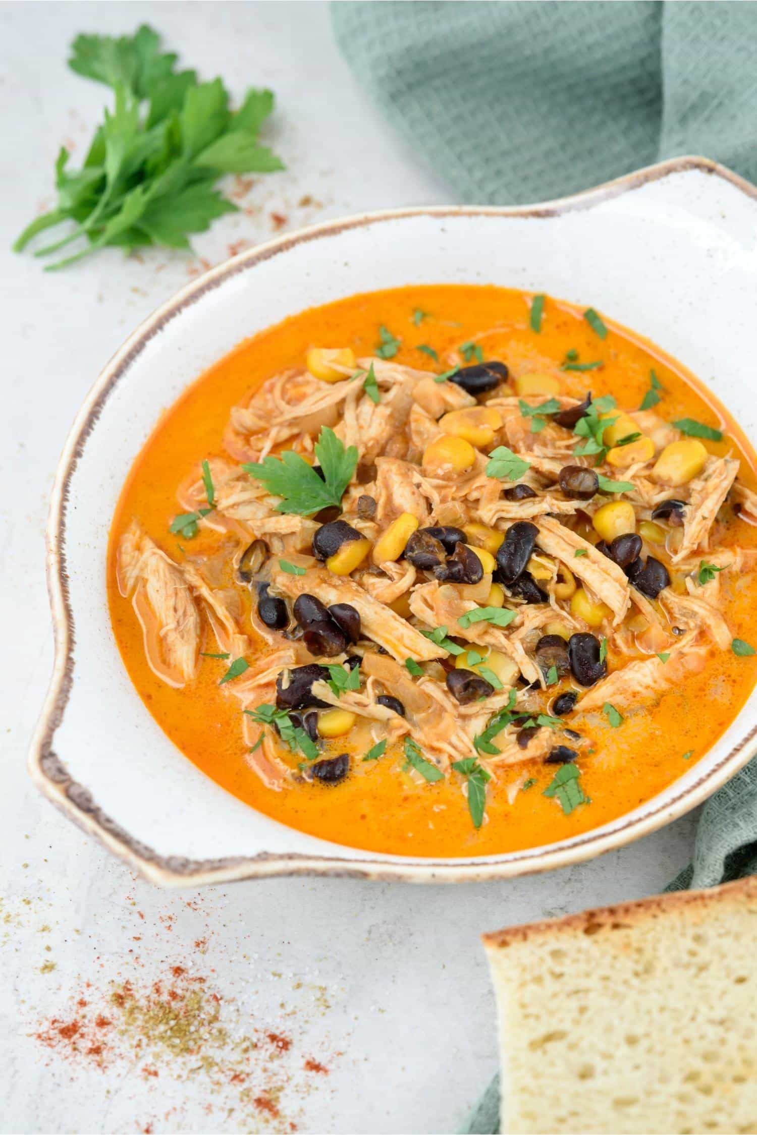 A bowl of chicken enchilada soup.